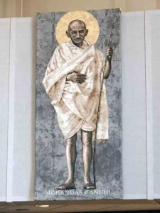 A portrait of Gandhi hangs in the Worship Space at Corpus Christi. 
